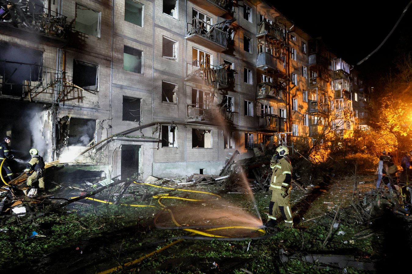Firefighters work at site of apartment building hit by Russian missile strike in Kyiv Ukraine August 1 2026