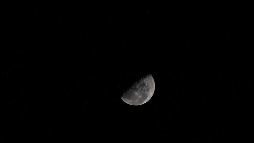 Last Quarter Moon photographed from the International Space Station showing the half-lit lunar disk