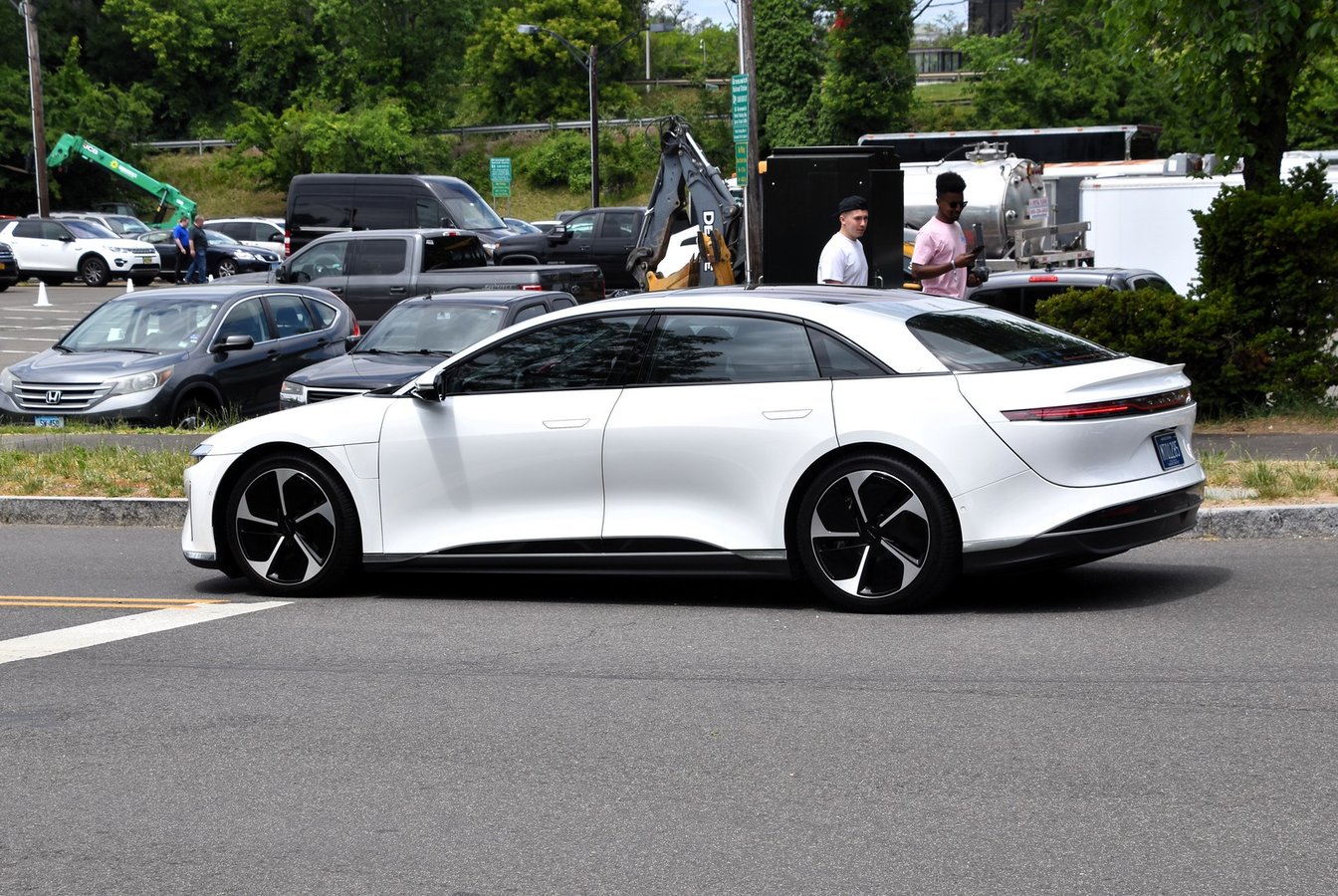 Lucid Air 2022 electric vehicle in light metallic finish shown at an automotive showcase