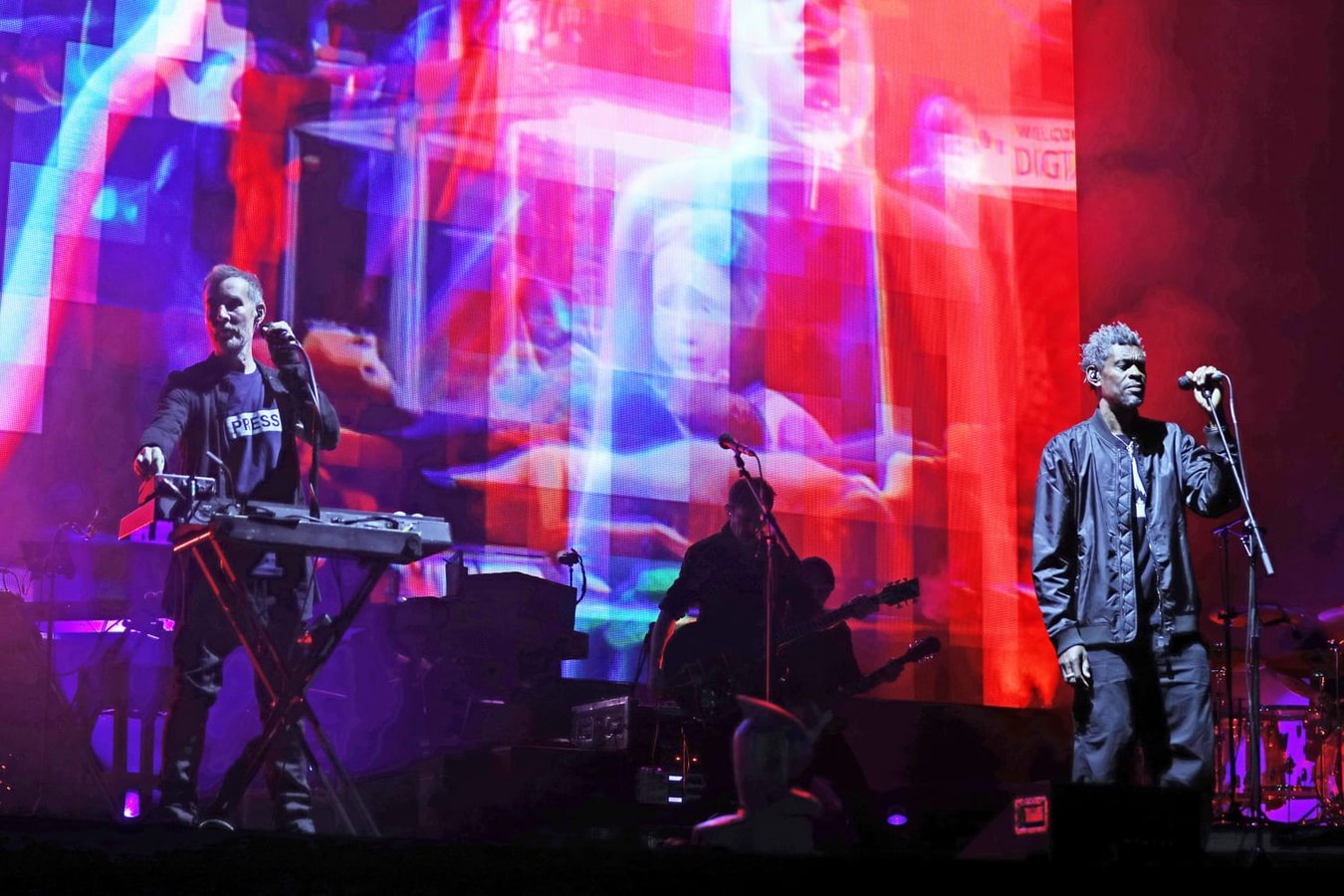 Massive Attack performance in Singapore on August 3 2026 where members raised a Palestinian flag and were later detained by police