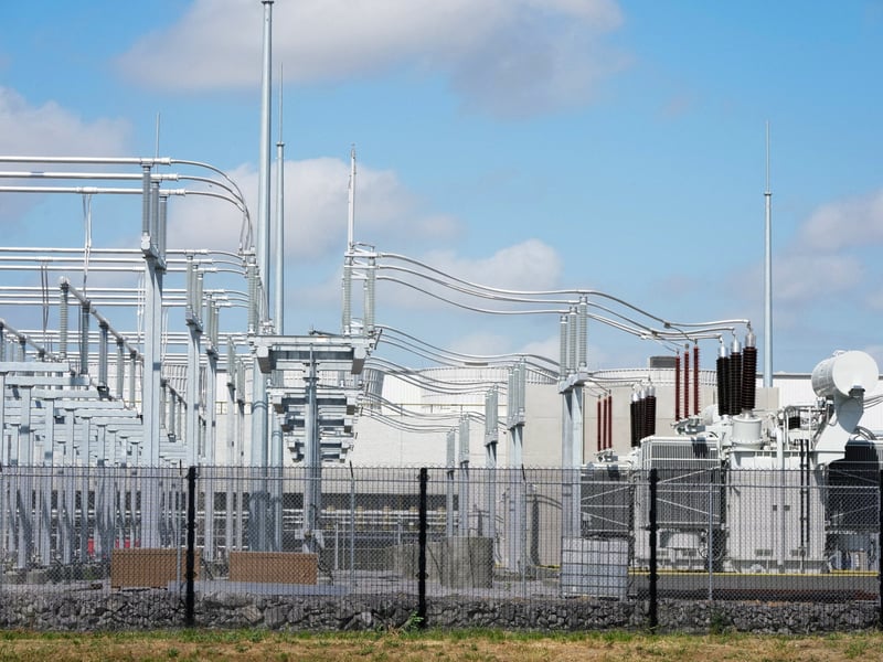META stock today: high-voltage electrical switchgear and transformers at a substation serving an American AI data centre