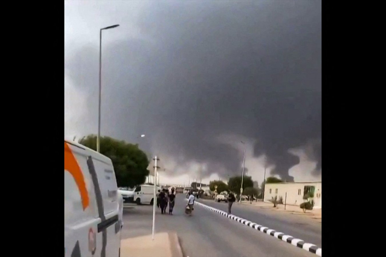 Smoke rises from Saudi Arabia energy infrastructure as Middle East conflict drives crude oil prices above 100 dollars in 2026
