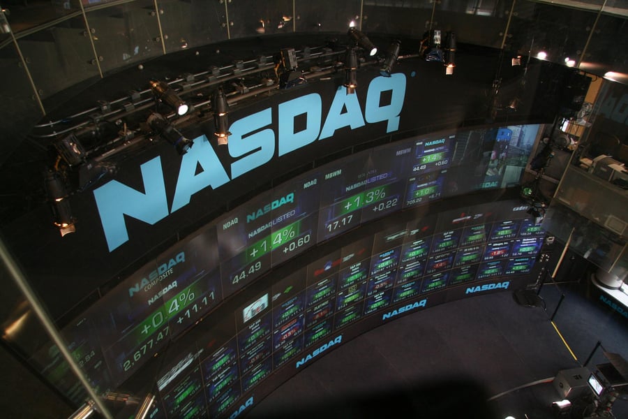 Nasdaq Composite stock market trading screens displaying real-time market data