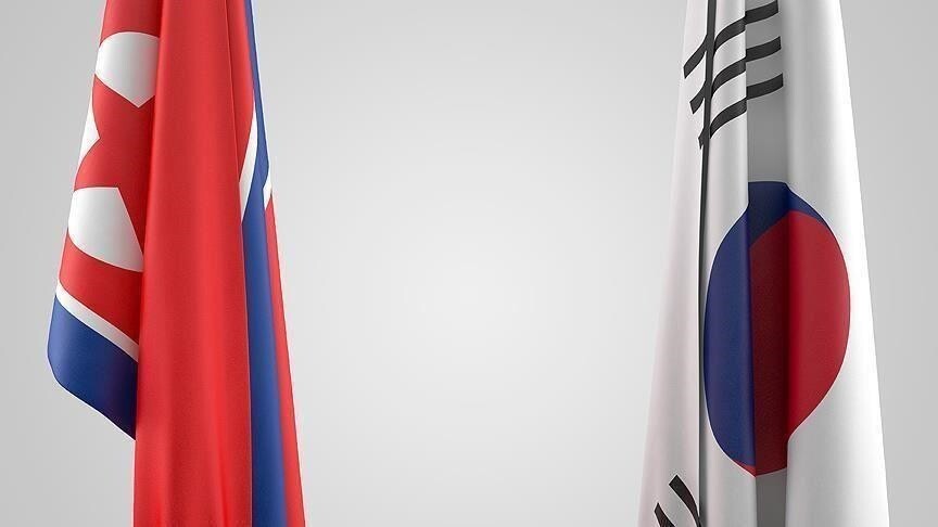 North Korea and South Korea flags side by side as Pyongyang fires 10 missiles after Trump curtails joint drills