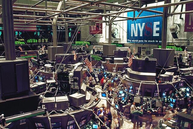 NYSE trading floor on Wall Street, New York, showing traders and market activity