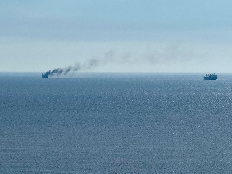 A civilian vessel appears to be on fire near the Black Sea port of Odesa after a reported Russian strike