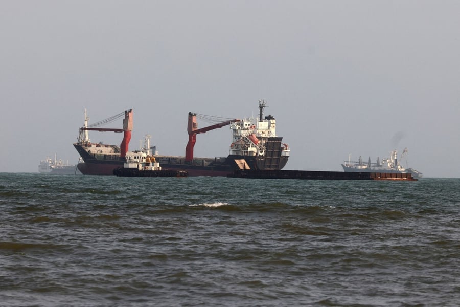 Vessels anchored in the Strait of Hormuz off Bandar Abbas in southern Iran as oil prices today push Brent crude above $91 a barrel