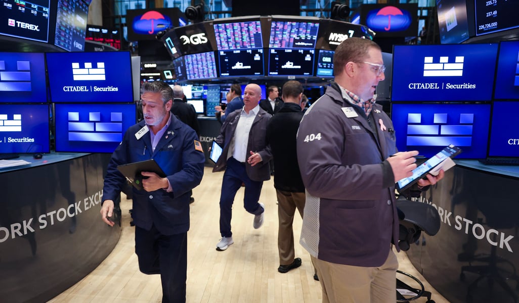 Traders on the floor of the New York Stock Exchange as oil prices today hold Brent crude near $94 a barrel