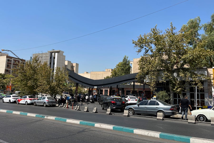 Motorists queuing at a Tehran petrol station in August 2026 as US sanctions restrict Iran's crude oil exports