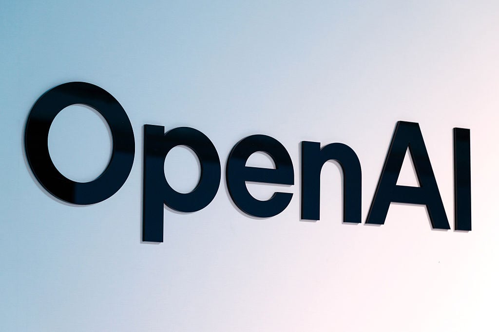 OpenAI logo illuminated in Seoul as the company acquires NextSlide and expands into AI presentation tools