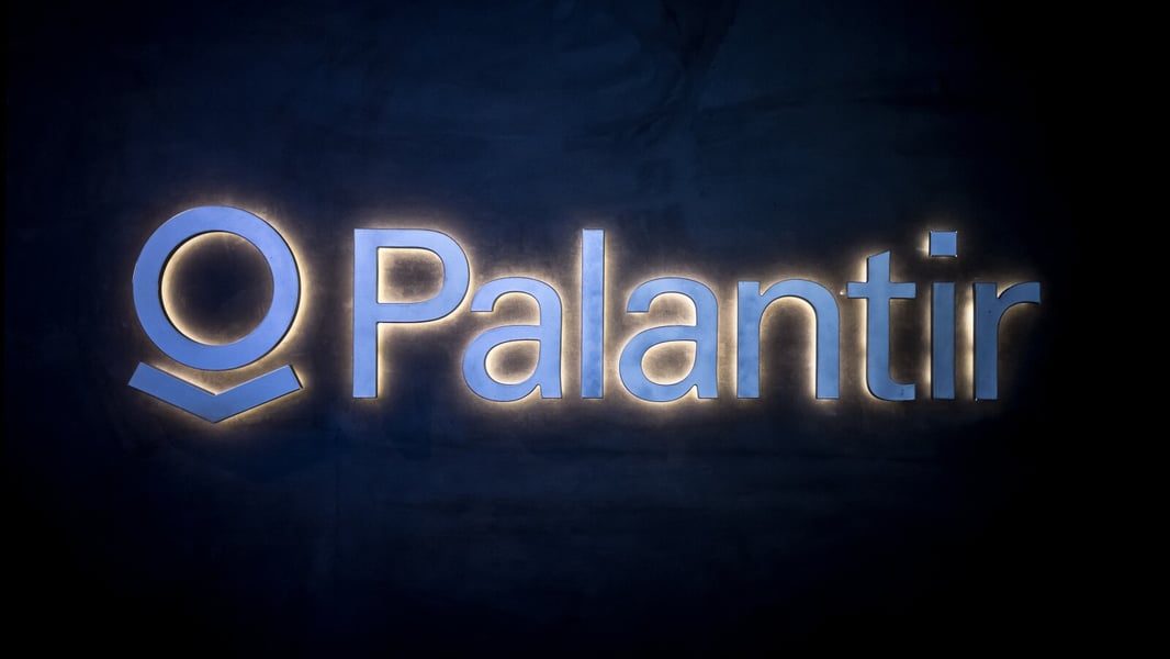 PLTR stock today: the illuminated Palantir Technologies logo photographed at the World Economic Forum annual meeting in Davos