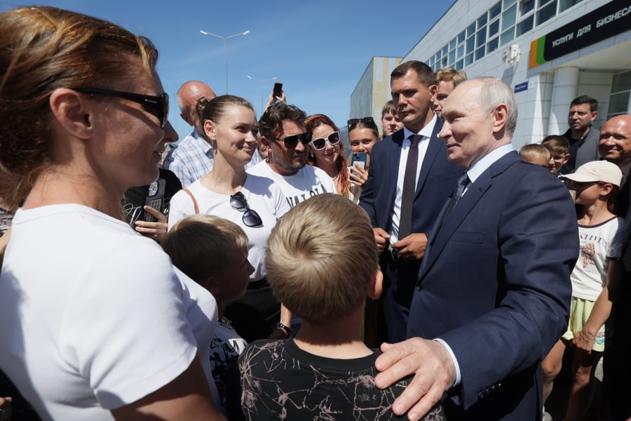 Vladimir Putin meets residents on Iturup Island in the disputed Kuril Islands, August 2026