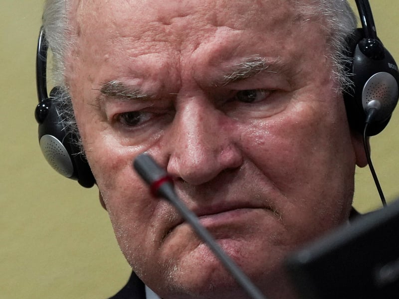 Ratko Mladic stands in the dock at the International Criminal Tribunal for the former Yugoslavia during his genocide trial