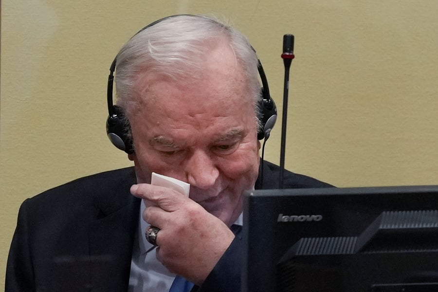 Ratko Mladic sits in the courtroom at The Hague during his trial for genocide and war crimes