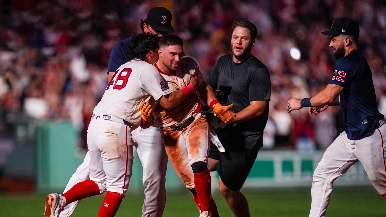 Red Sox players celebrate after rallying to beat the White Sox at Fenway Park