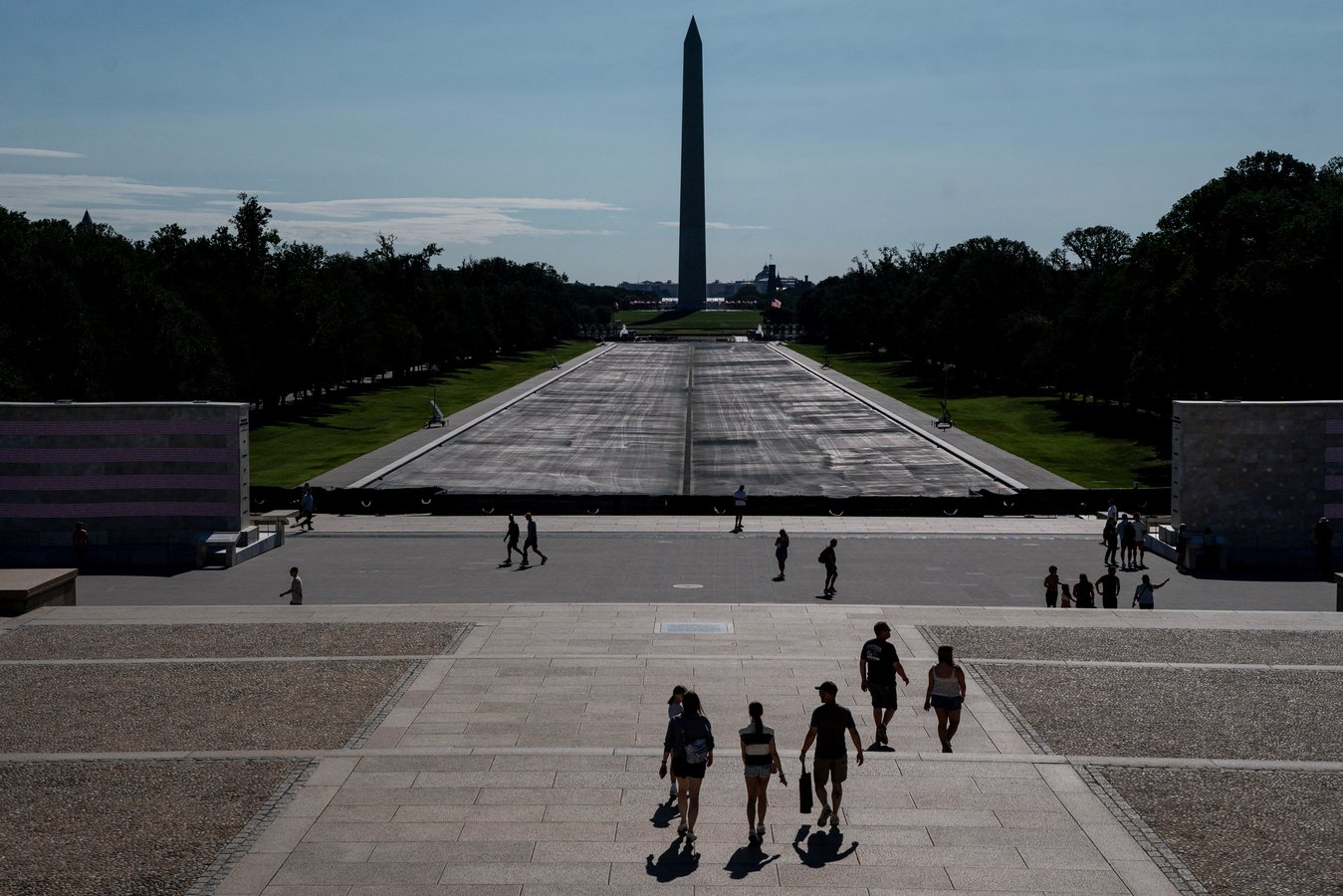 Visitors walk near the drained Lincoln Memorial Reflecting Pool in Washington DC after Trump botched renovation