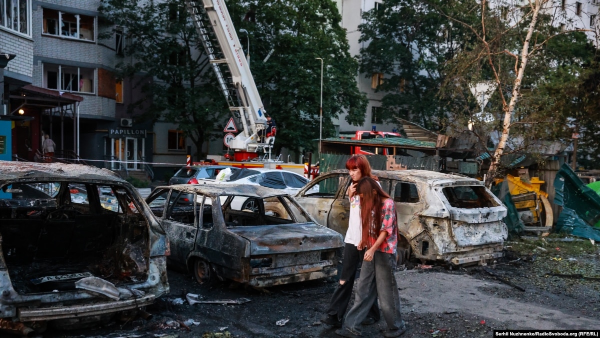 Aftermath of Russian ballistic missile attack on Kyiv August 1 2026 with damaged buildings and emergency responders