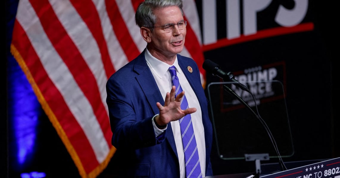 US Treasury Secretary Scott Bessent speaking at a podium in Asheville, North Carolina