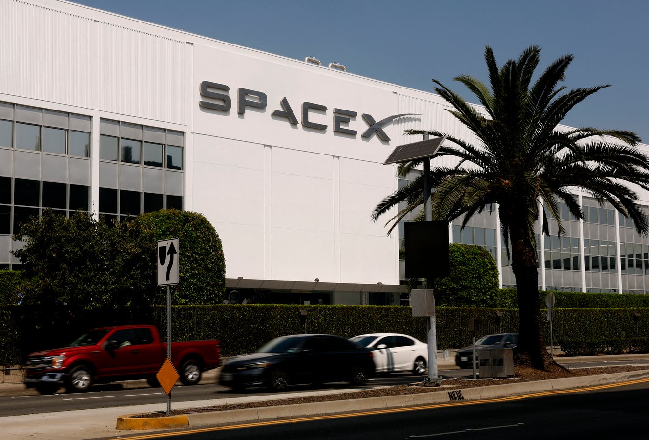 SpaceX IPO stock debut displayed on screen in New York City