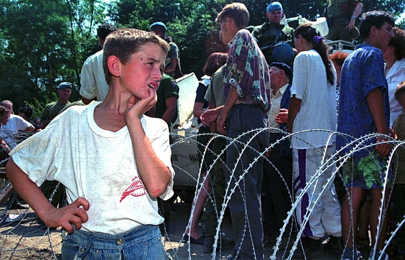 Srebrenica refugees in a UN vehicle in 1995 as Bosnian Serb forces overran the UN-declared safe area in eastern Bosnia