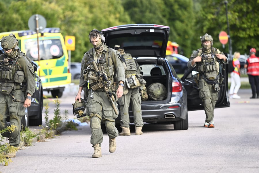 Police and emergency personnel outside Brinellskolan school in Fagersta Sweden after sword attack killing one student on August 21 2026