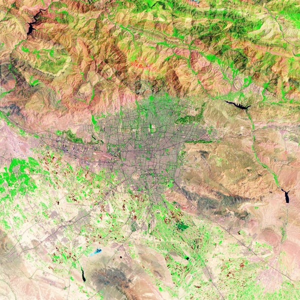 NASA Landsat satellite image of Tehran, Iran from 2009 showing the Iranian capital's urban sprawl extending across the landscape at the foot of the Alborz Mountains