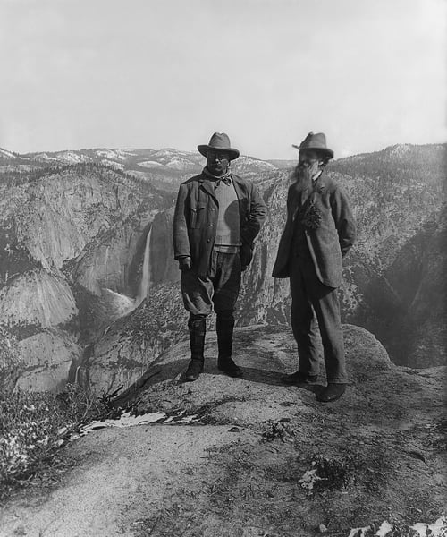 Theodore Roosevelt and the naturalist John Muir standing on Glacier Point above Yosemite Valley in 1903