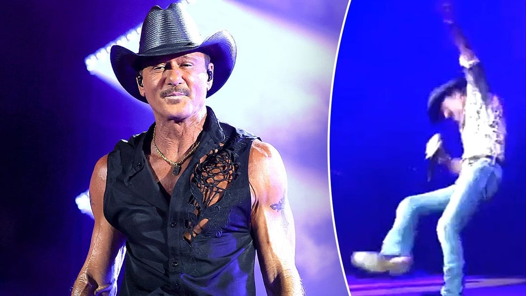 Tim McGraw falling on his back on stage at Riverbend Music Center in Cincinnati during his summer concert