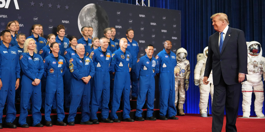 President Donald Trump with the Artemis II astronauts at NASA Johnson Space Center after signing the US Space Academy executive order