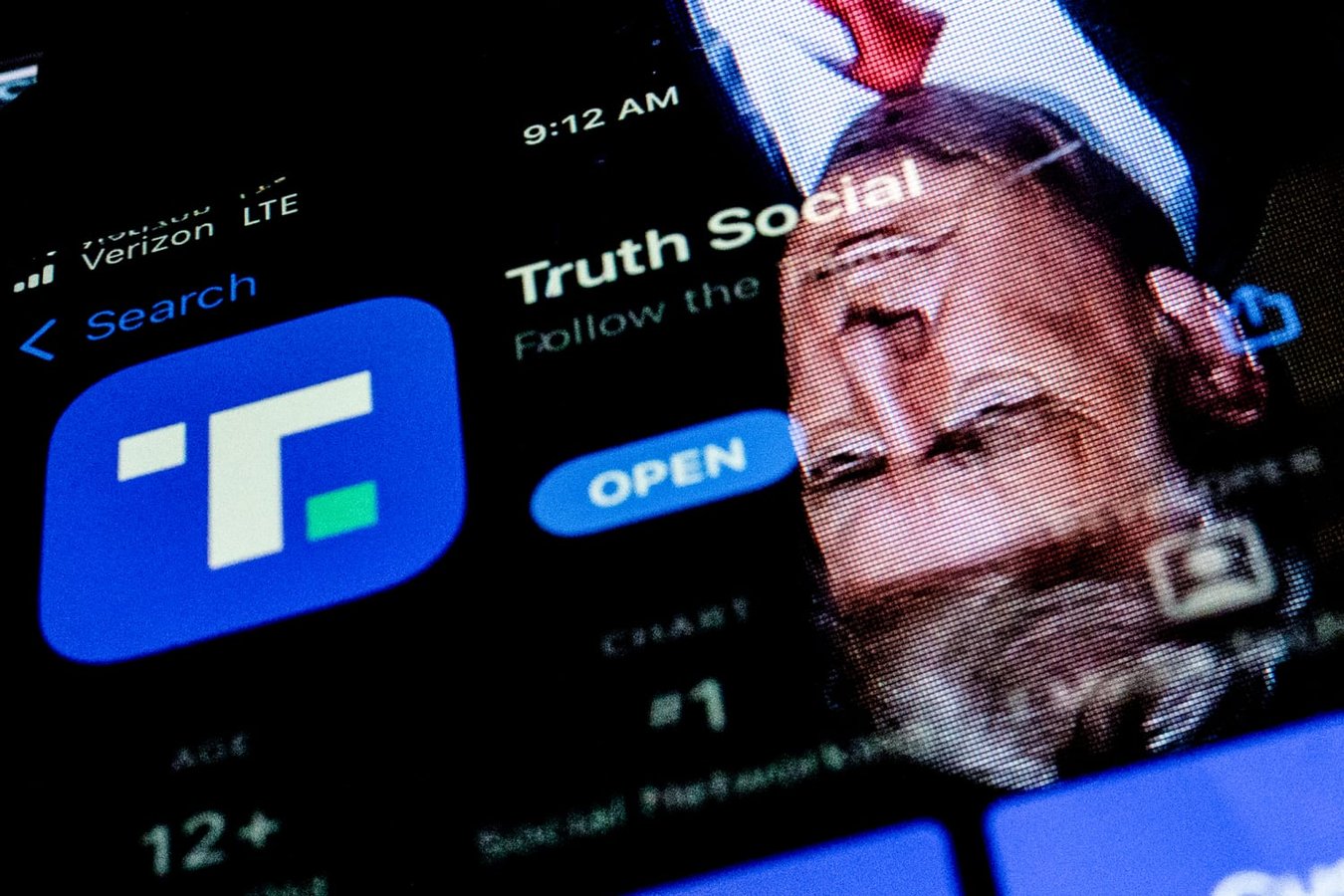 Photo illustration showing President Trump reflected on a phone screen displaying the Truth Social app, at the center of the Truth API controversy