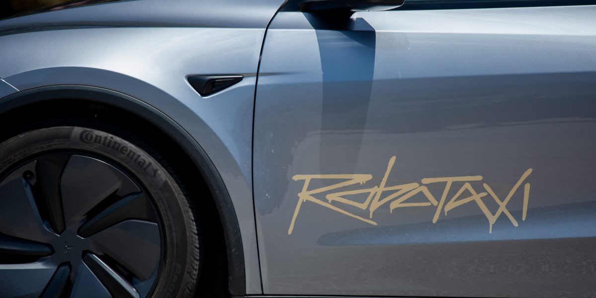 TSLA stock today: the Robotaxi wordmark on the flank of a Tesla, the marking Nevada regulators require on approved autonomous vehicles