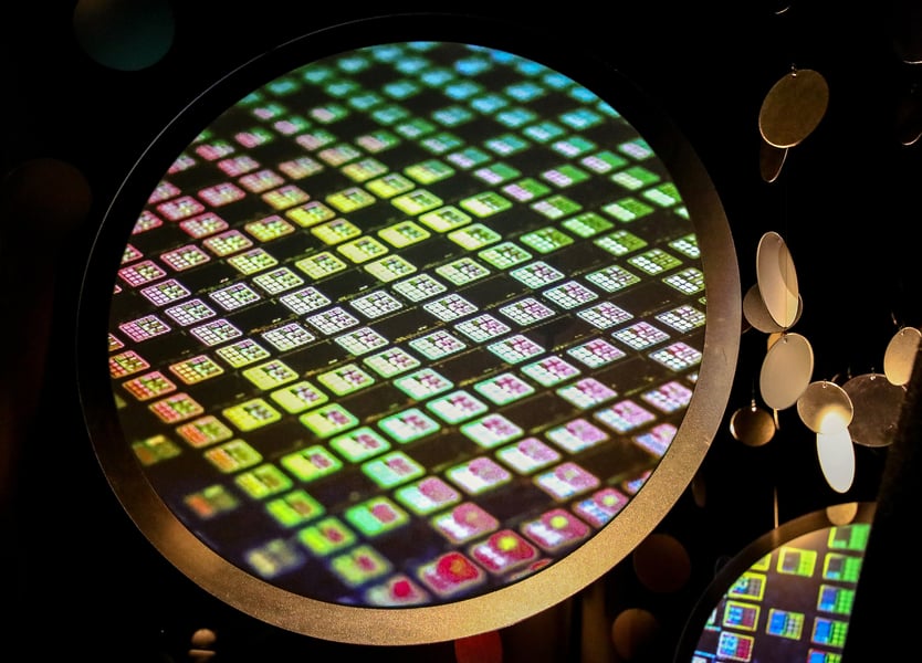TSMC semiconductor chip wafer displayed at the TSMC Museum of Innovation in Hsinchu Taiwan, showing colorful die patterns