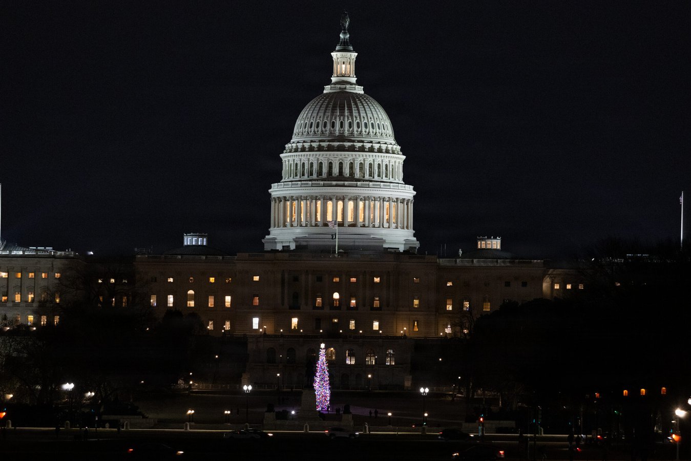 US Capitol building illuminated at night in Washington DC