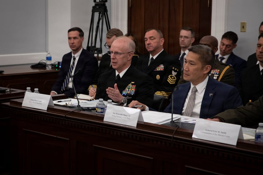 A US Navy warship under way, as the service diverts payroll funds to cover Iran war operations