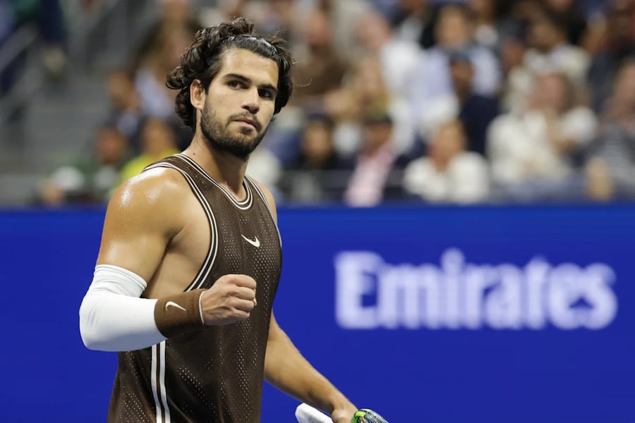 Carlos Alcaraz in action at Arthur Ashe Stadium during his second-round US Open 2026 match against Jaime Faria
