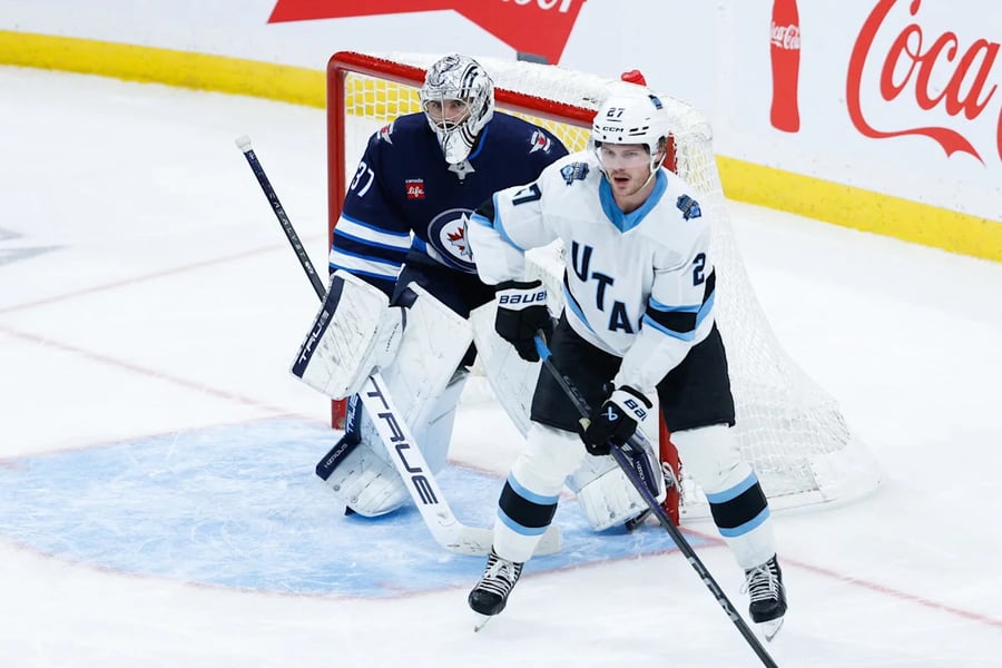 Connor Hellebuyck in Winnipeg Jets gear as trade standoff deepens