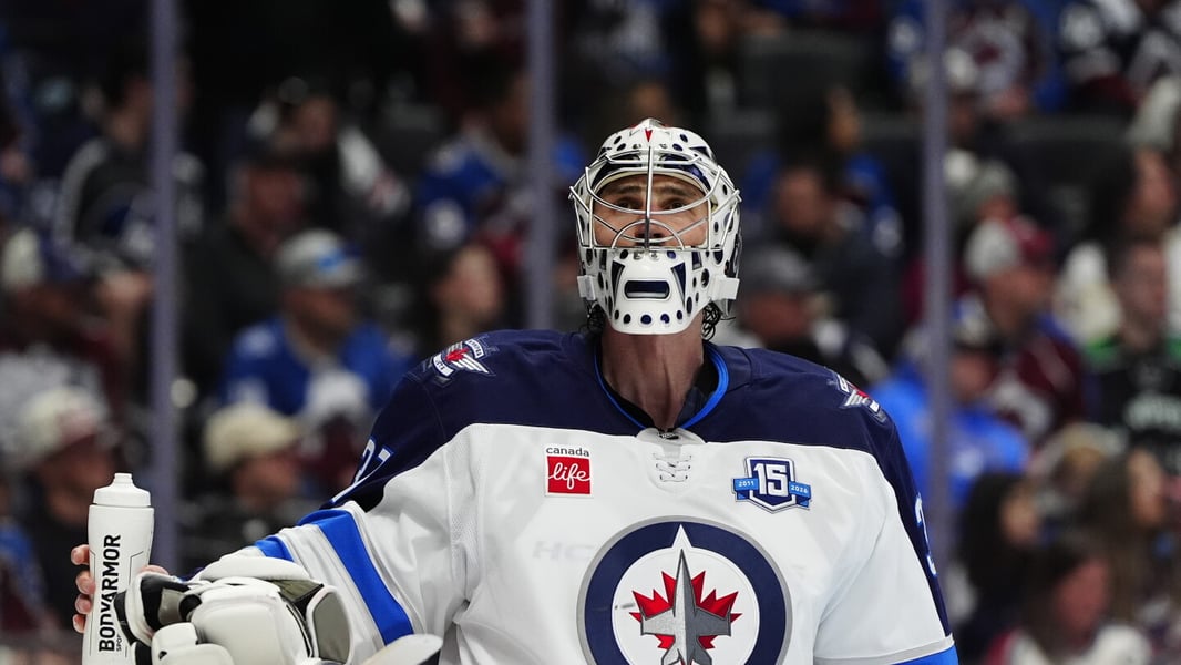 Connor Hellebuyck making a save for the Winnipeg Jets during the 2025-26 NHL season