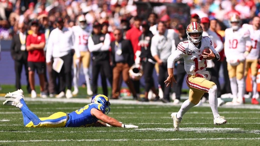 San Francisco 49ers players celebrate during their 27-7 victory over the Los Angeles Rams at the Melbourne Cricket Ground