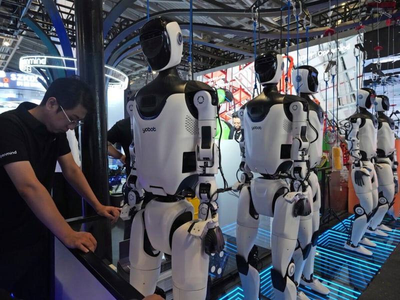 A researcher monitors AI computing infrastructure at a technology company as the gap between frontier lab and enterprise AI compensation reaches historic levels in 2026