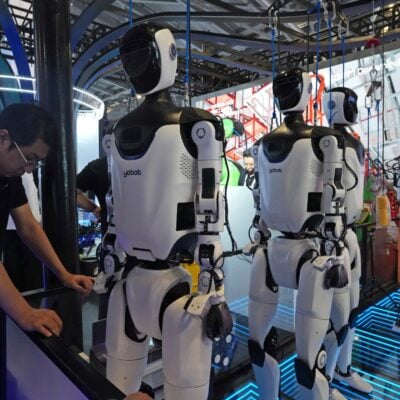 A researcher monitors AI computing infrastructure at a technology company as the gap between frontier lab and enterprise AI compensation reaches historic levels in 2026