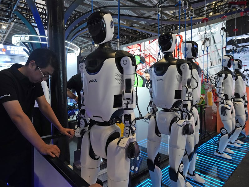 A researcher monitors AI computing infrastructure at a technology company as the gap between frontier lab and enterprise AI compensation reaches historic levels in 2026