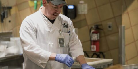Whole Foods Market store employees at work as Amazon announces $230 million wage investment