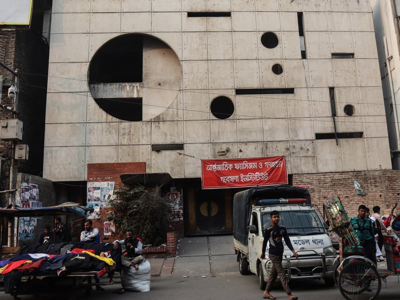 Police guard the front of Awami League's vandalised central office in Dhaka, Bangladesh