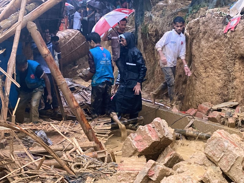 Rescue workers at the site of a landslide that hit a Rohingya school in Cox's Bazar Bangladesh July 2026
