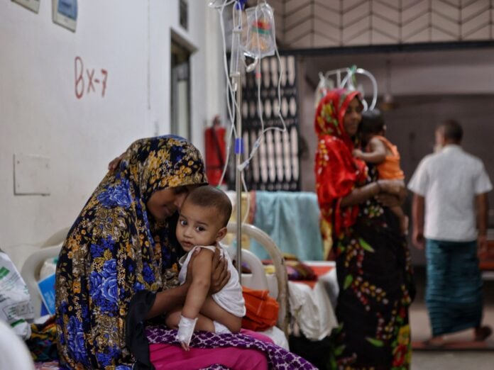 A healthcare worker administers a measles vaccine to a child in Bangladesh during the 2026 emergency vaccination campaign