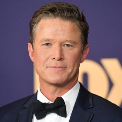 Billy Bush smiling at a media event, photographed in 2019