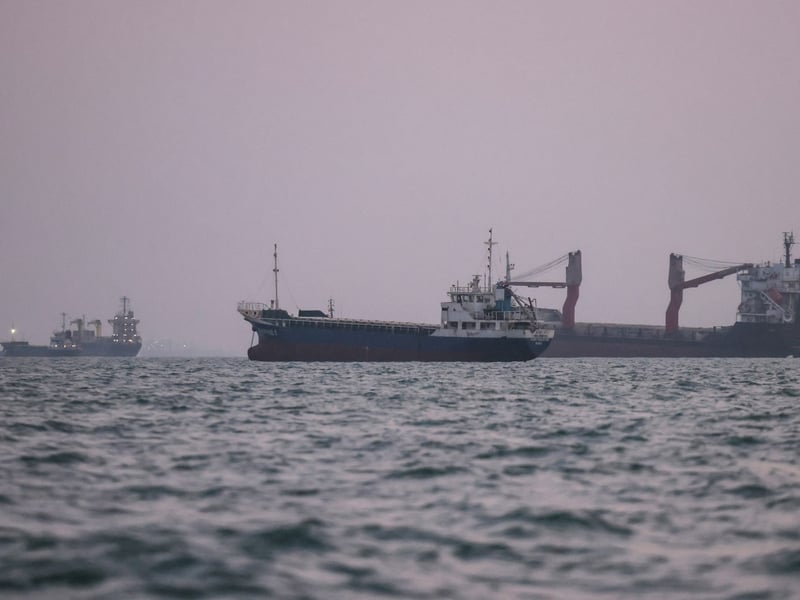 Burning Iranian tanker in the Persian Gulf as US-Iran maritime conflict escalates driving Brent crude above $97
