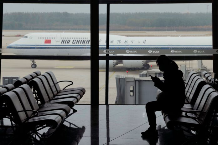 Chinese border control checkpoint illustrating new exit ban restrictions under Decree 841