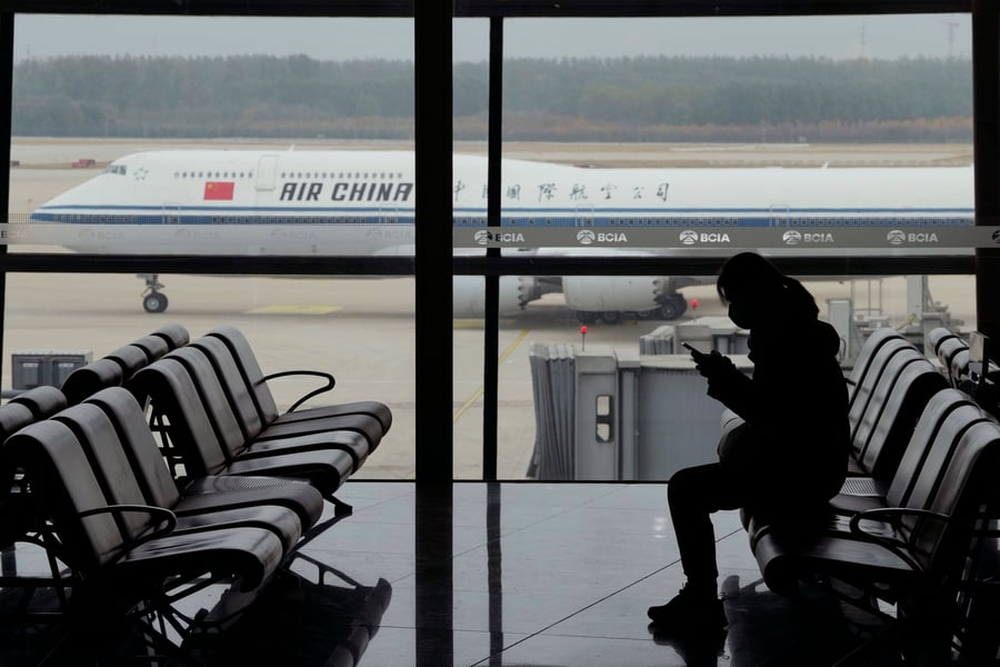 Chinese border control checkpoint illustrating new exit ban restrictions under Decree 841