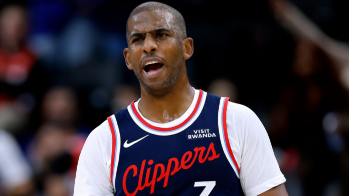 Chris Paul looks on during a Los Angeles Clippers game, his No. 3 jersey now reassigned to Bradley Beal